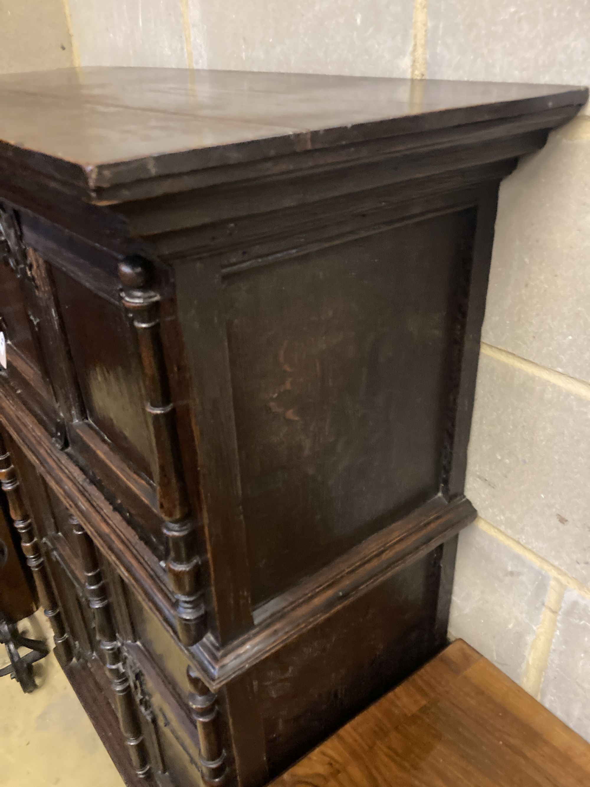 A 17th century style oak cupboard, width 100cm depth 42cm height 140cm